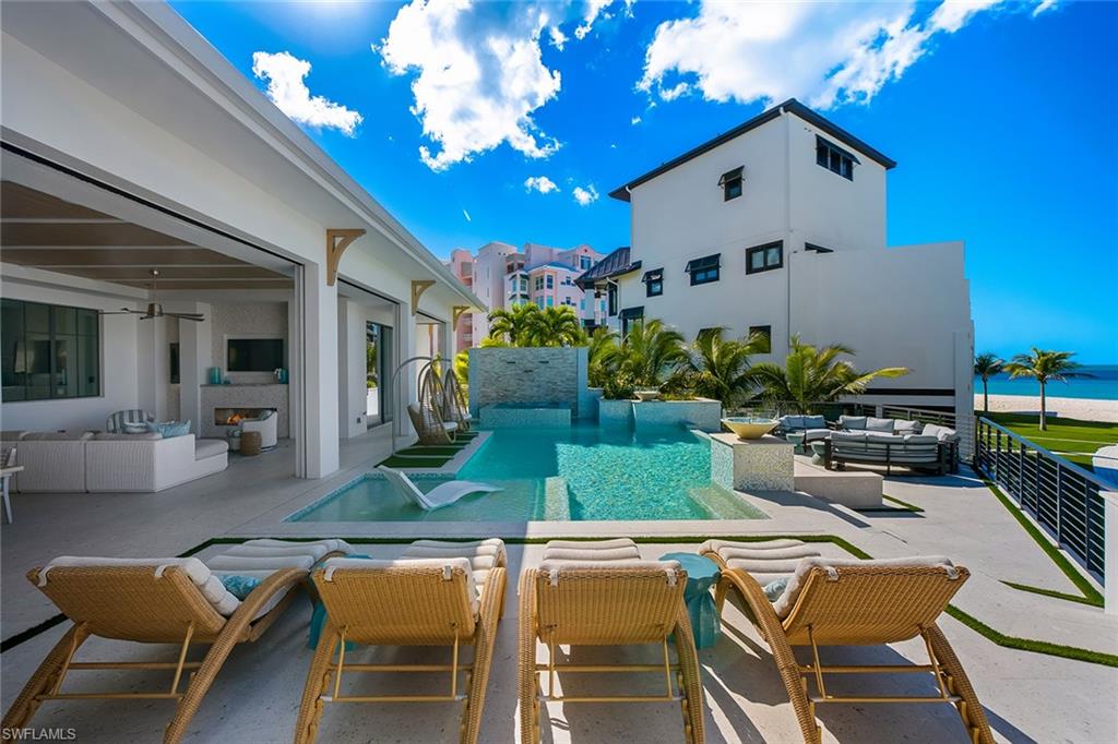 Swimming pool with an outdoor living space and a patio area
