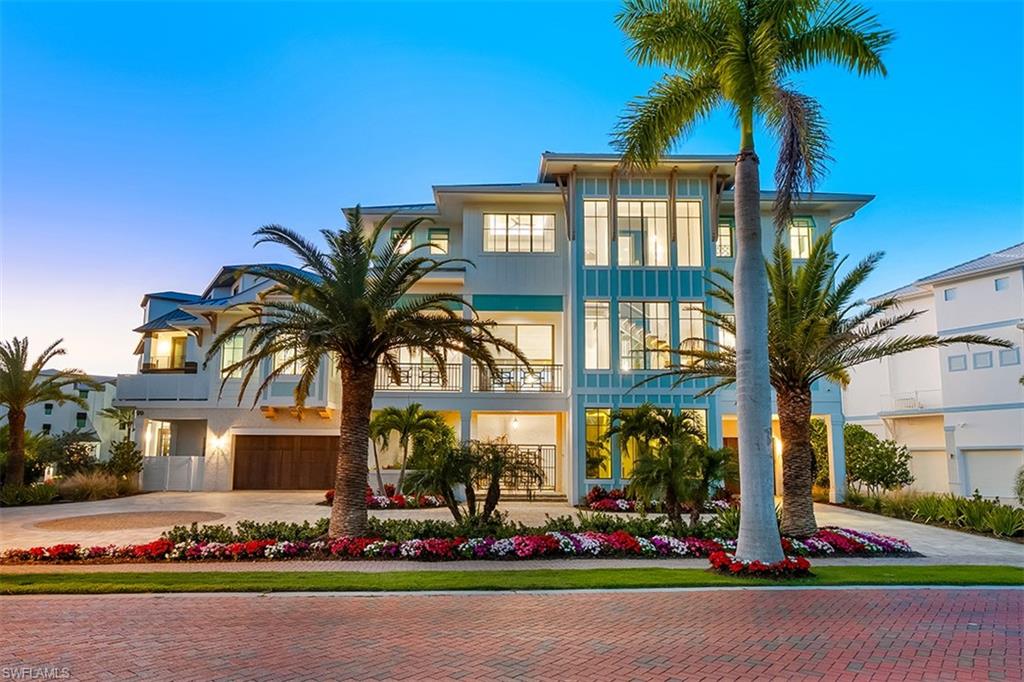 View of front of property featuring decorative driveway