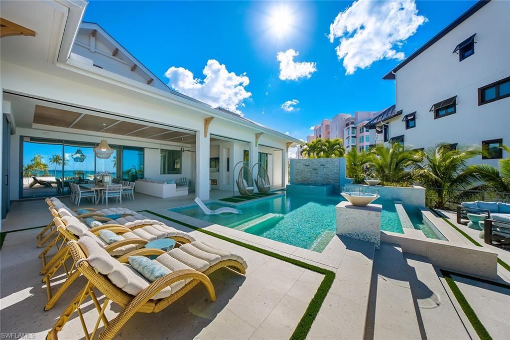 Swimming pool with a patio, an outdoor hangout area, and outdoor dining space
