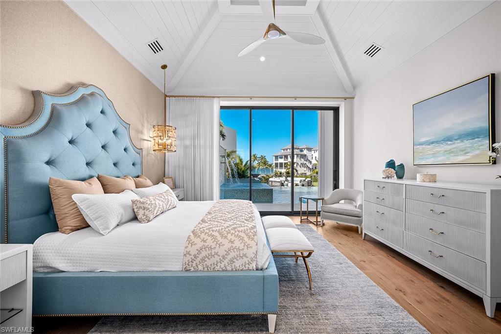 Bedroom with light wood-style flooring, access to outside, vaulted ceiling, wooden ceiling, and a ceiling fan