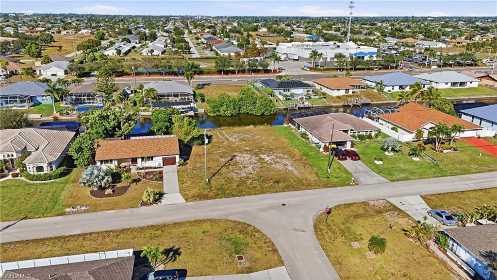 Aerial view of residential area with a nearby body of water