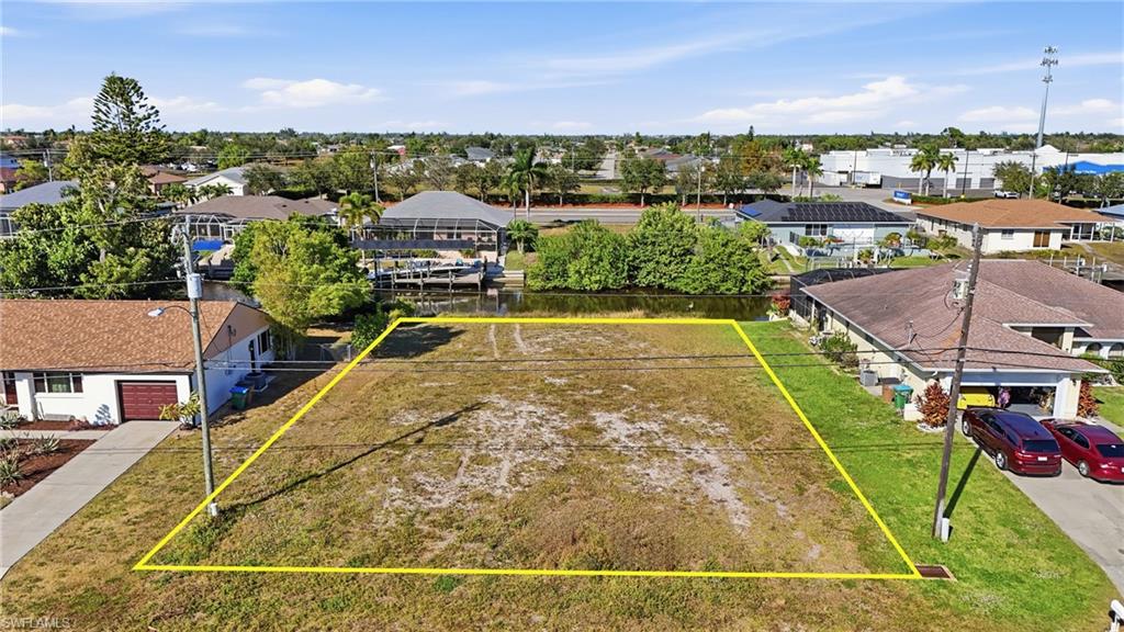 Aerial perspective of suburban area featuring property parcel outlined