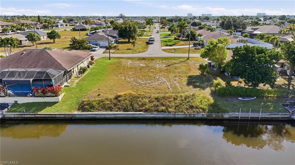 Aerial perspective of suburban area with a large body of water
