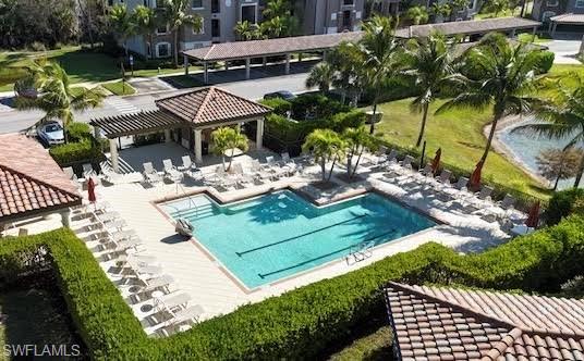 Community pool with a patio, a gazebo, and a pergola
