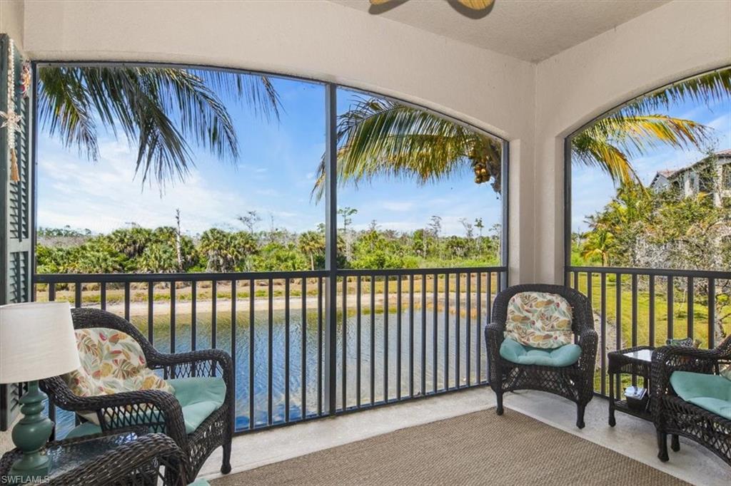 Sunroom / solarium with a water view