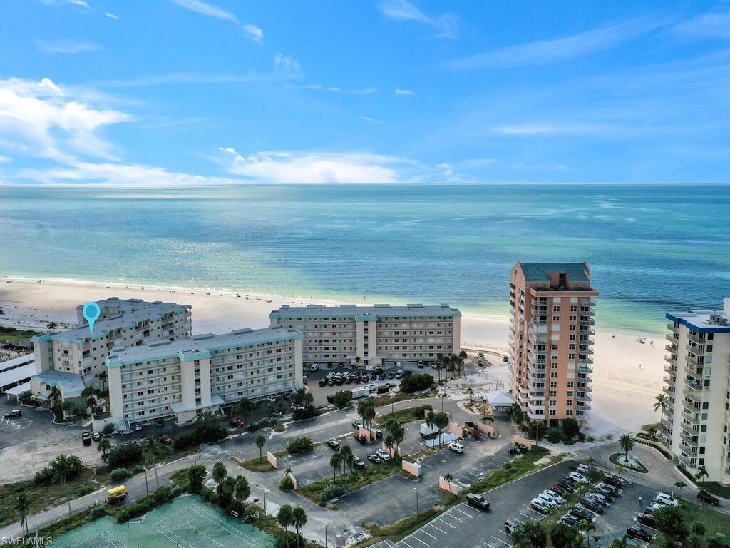 Aerial overview of property's location featuring extended coastline