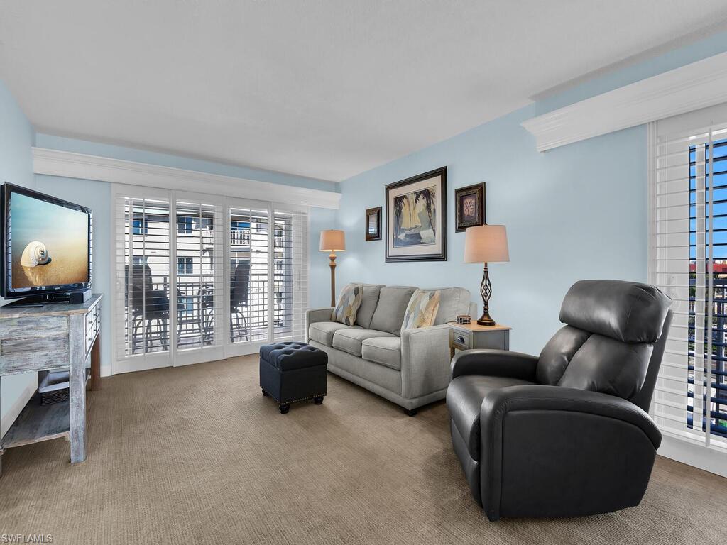 Living area with carpet flooring
