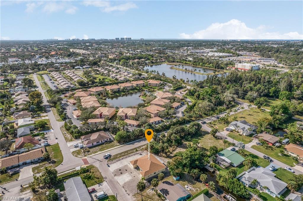 Aerial view of property's location featuring nearby suburban area