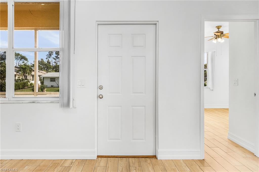 Foyer featuring light wood-style tile flooring and a ceiling fan