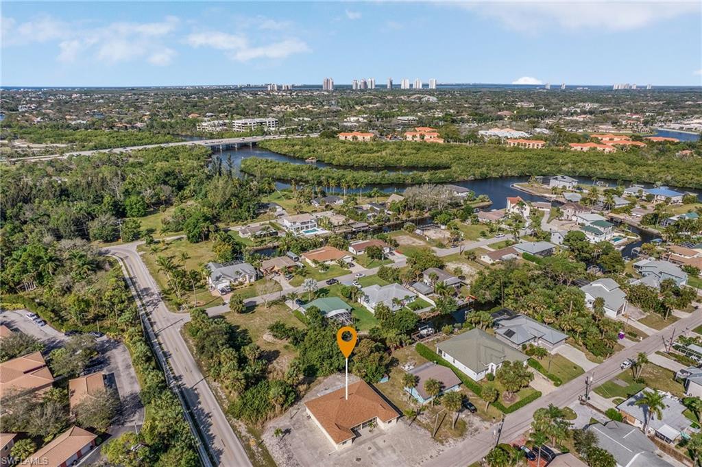 Aerial overview of property's location with nearby suburban area