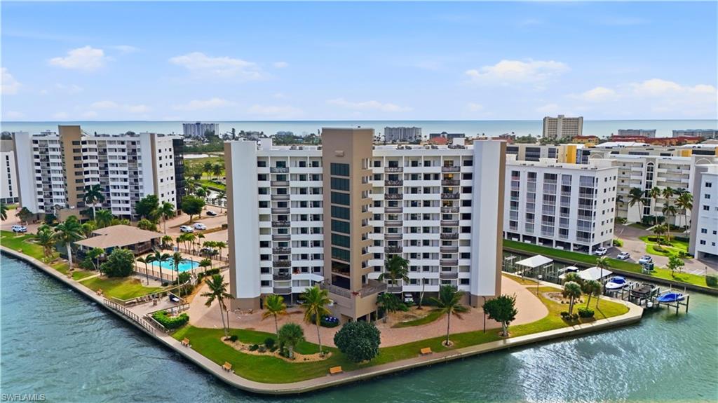 Aerial view of Harbour Pointe with canals to Estero Bay - Virtually Edited Image