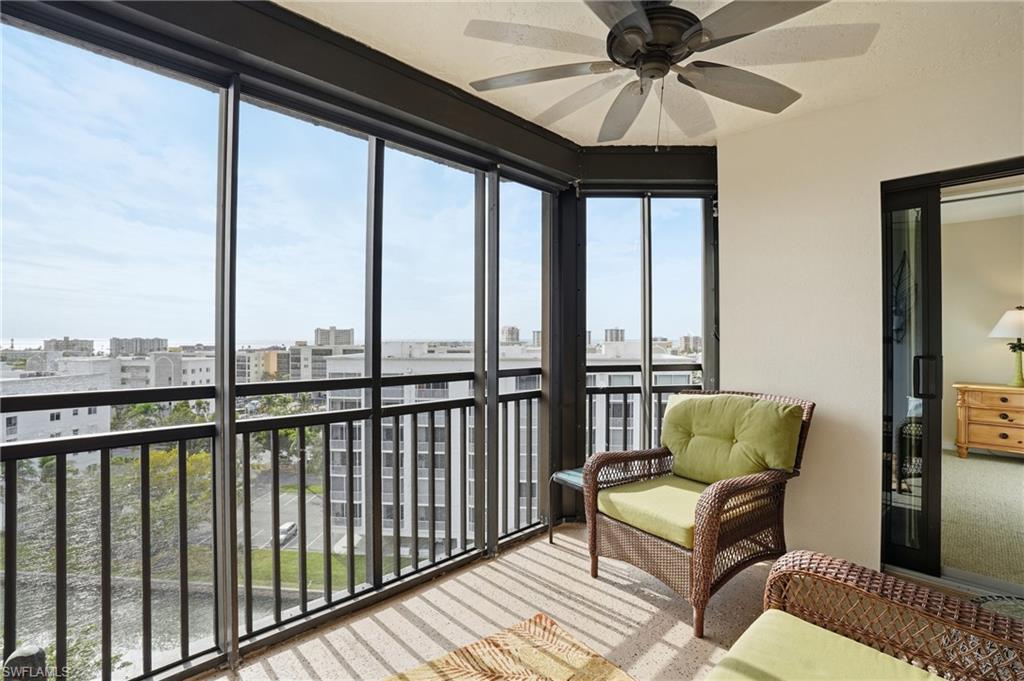 Screened in balcony with a view of canal with Boat Docks - Virtually Edited Image