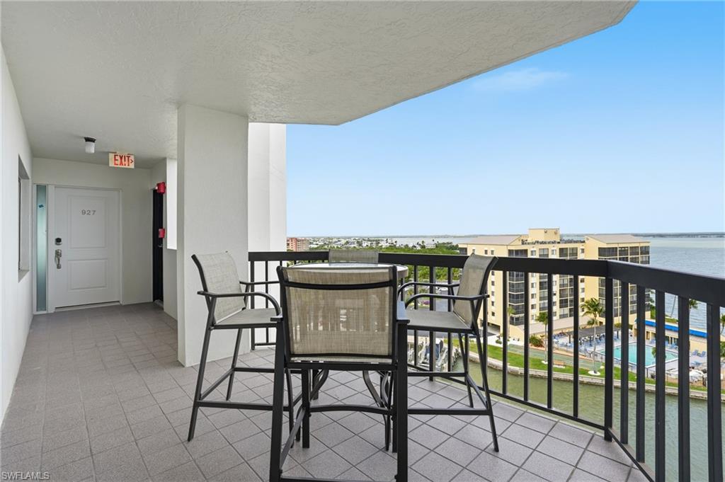 Outdoor seating area featuring view of Estero Bay right outside of front door- Virtually Edited Image