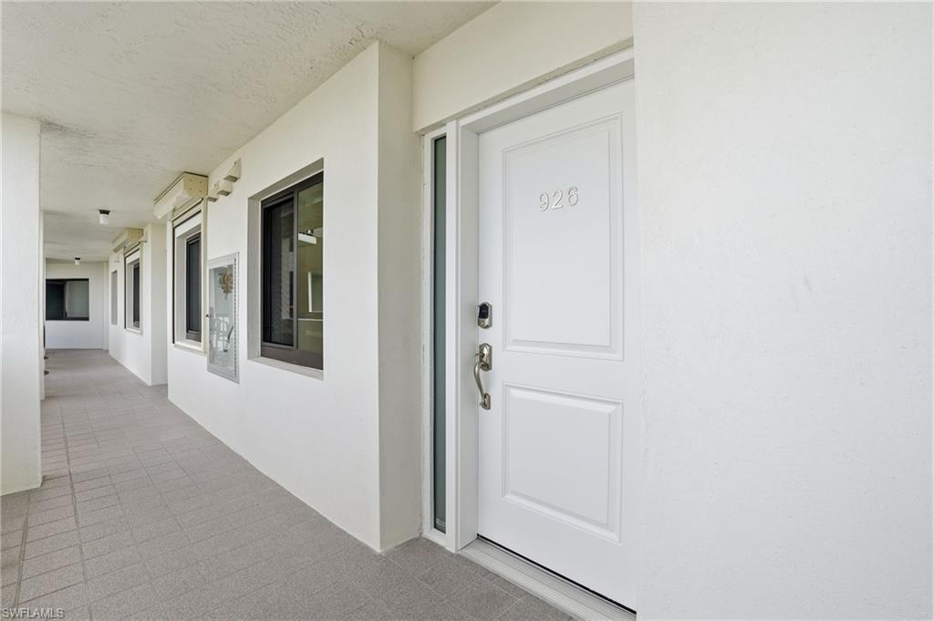 Doorway to property with stucco siding & new door - Virtually Edited Image