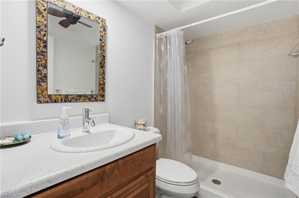 Guest bathroom with vanity and a shower - Virtually Edited Image
