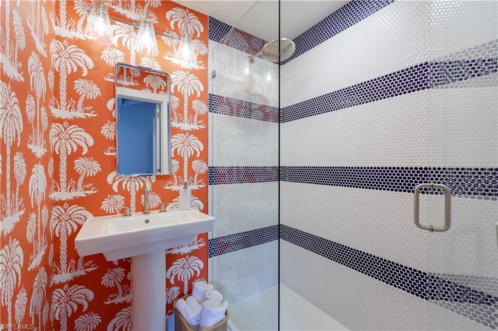 Bathroom with a shower with door