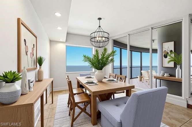 VIRTUALLY STAGED. Dining area with wood-finish flooring and integrated recessed lighting