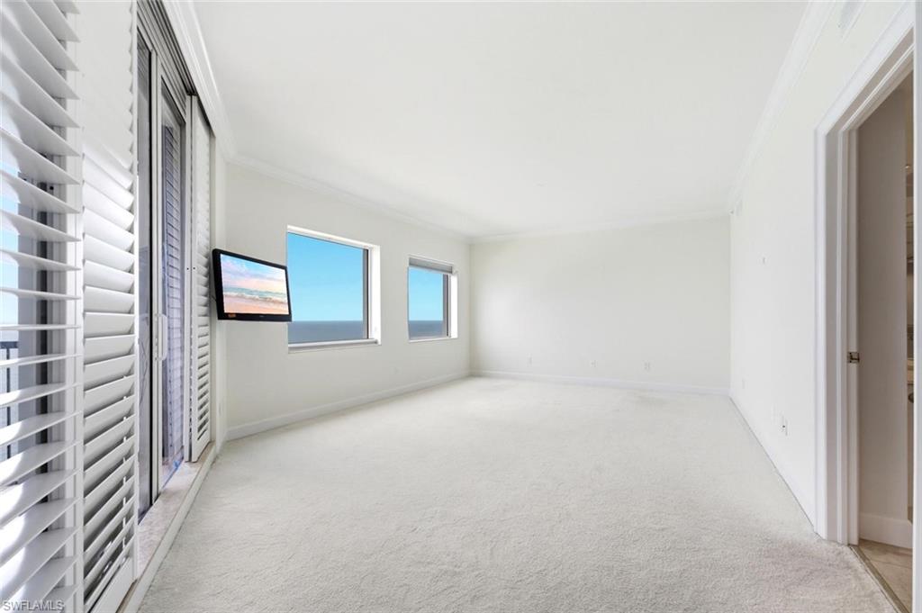 Wall-mounted television with multiple windows showcasing water scenery