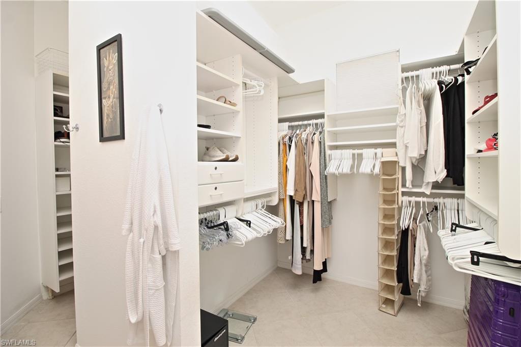 Walk in closet featuring light tile patterned floors