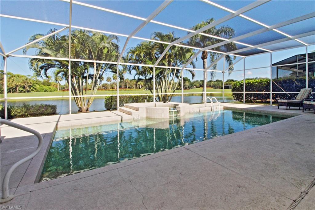 Outdoor pool featuring a lanai, a sunroom, a water view, and a jacuzzi