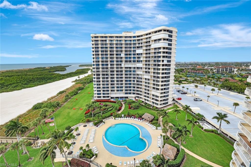 Bird's eye view of apartment complex and a nearby body of water