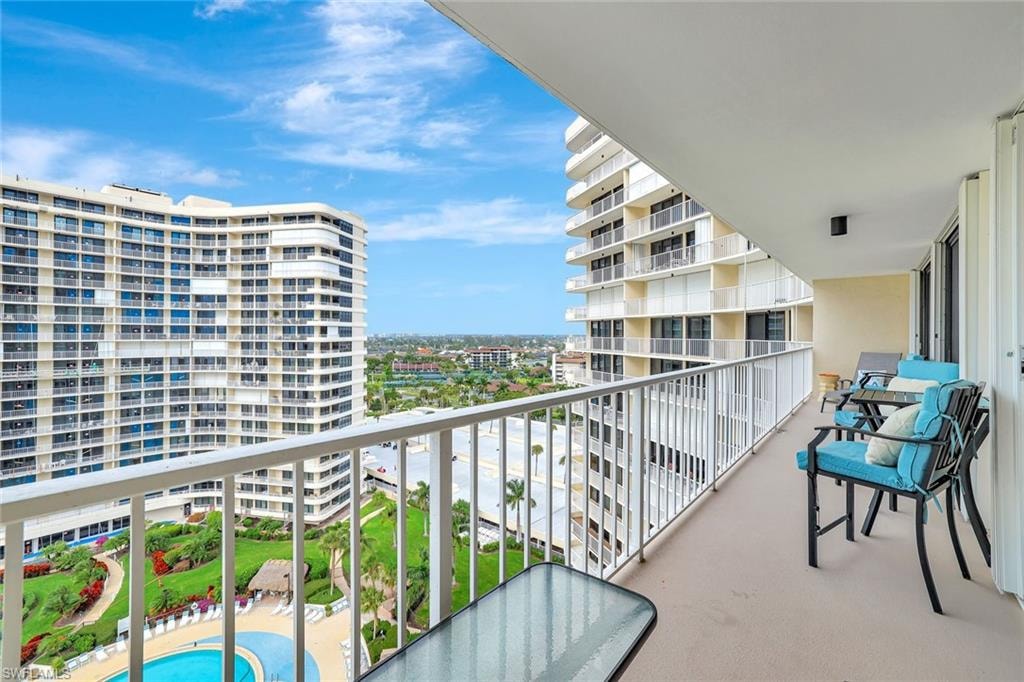 Balcony featuring view of pool