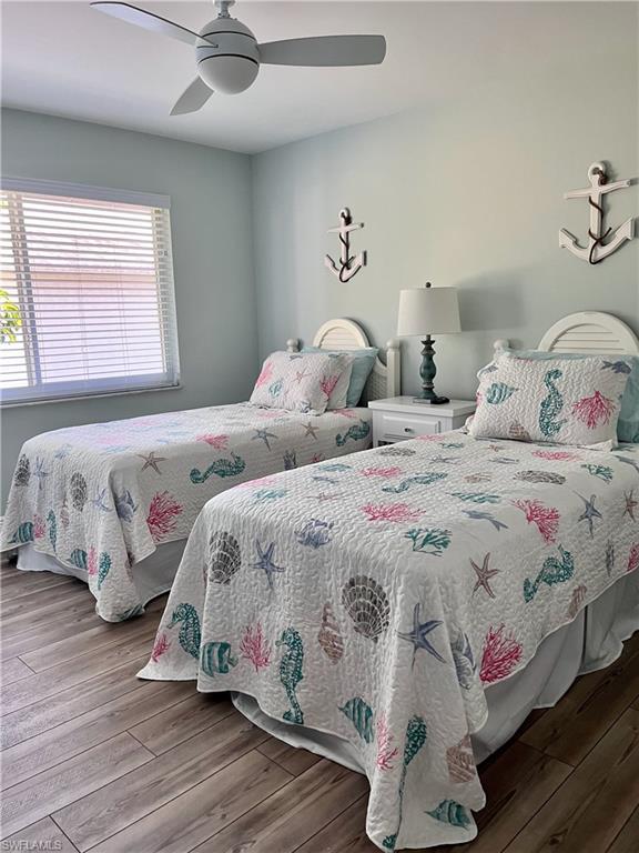 Bedroom featuring ceiling fan and hardwood / wood-style floors
