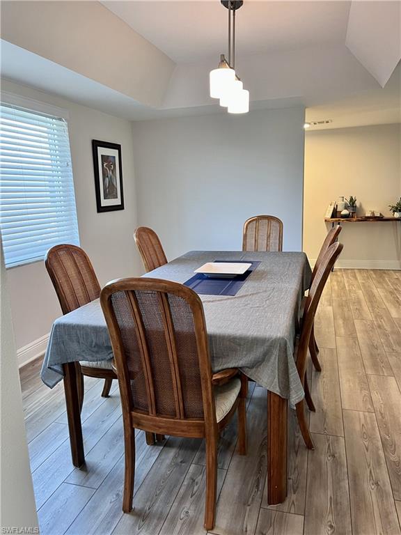 Dining area featuring hardwood / wood-style flooring