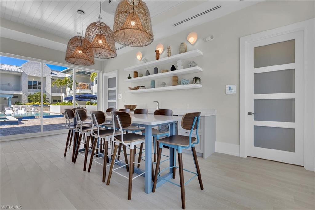 Dining space with light hardwood / wood-style flooring