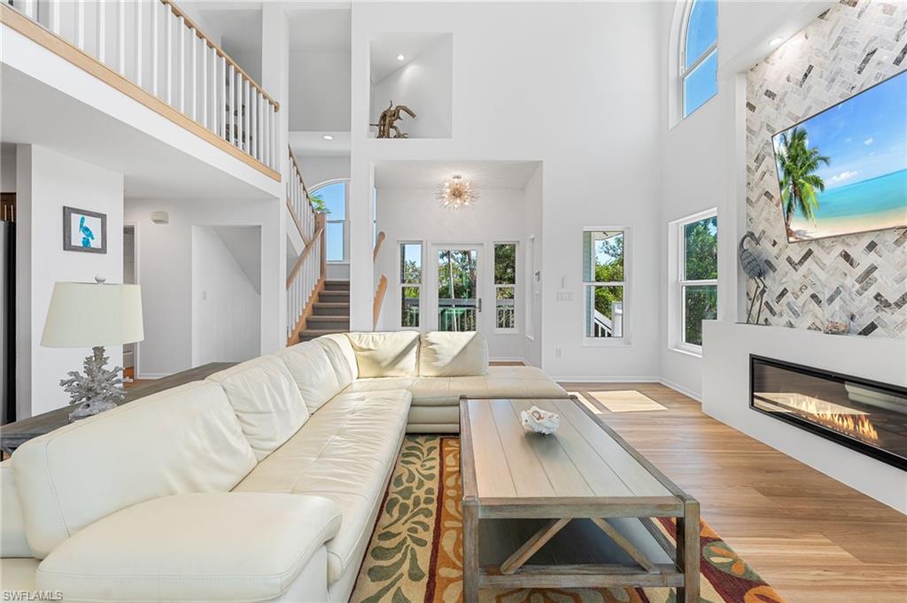 Expansive windows bring the outdoors in, creating a bright and airy gathering space.