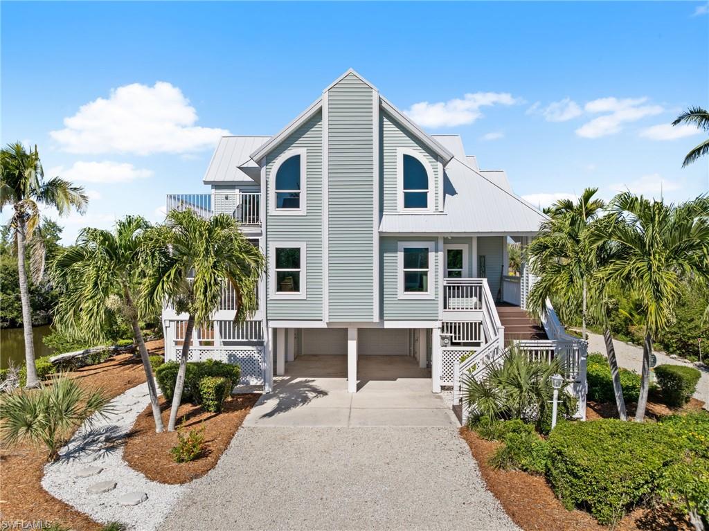 New roof, new siding, and thoughtful coastal updates create a fresh, modern first impression.