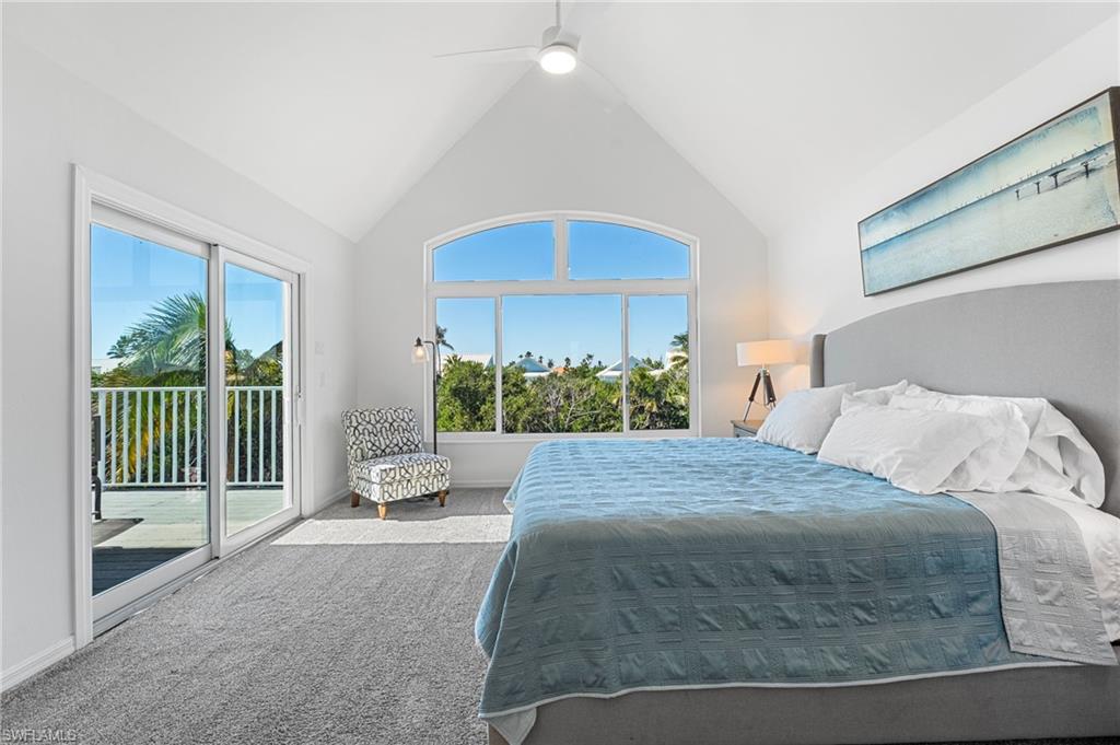 The elevated primary suite offers a peaceful private retreat with beautiful lake views.