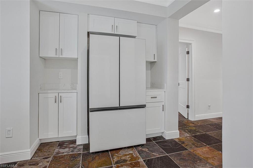 1st floor snack area with full size refridge in 1st floor livingroom