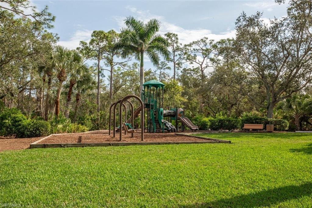Community playground with a lawn at spring creek