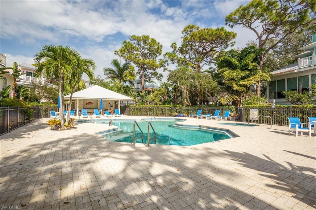 Cracker Cove Community pool with a patio