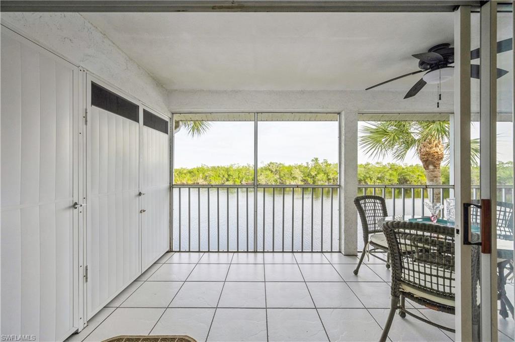 Sunroom with a water view