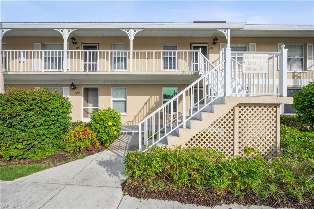 View of apartment building / complex featuring stairway