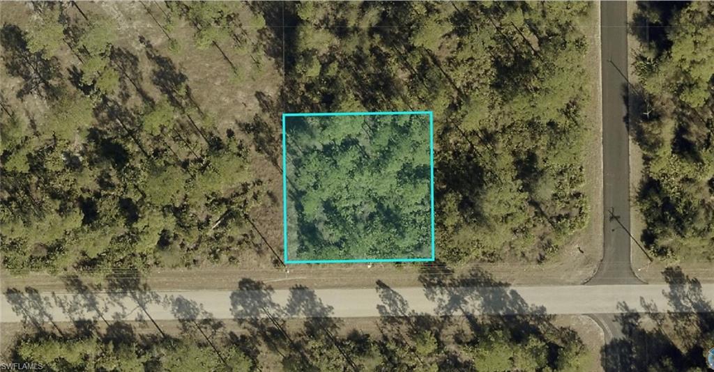 Aerial map of property and surrounding area featuring property parcel outlined