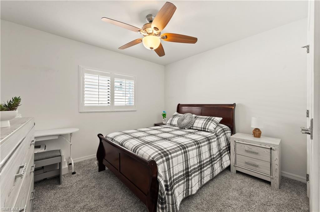 Bedroom featuring carpet and ceiling fan