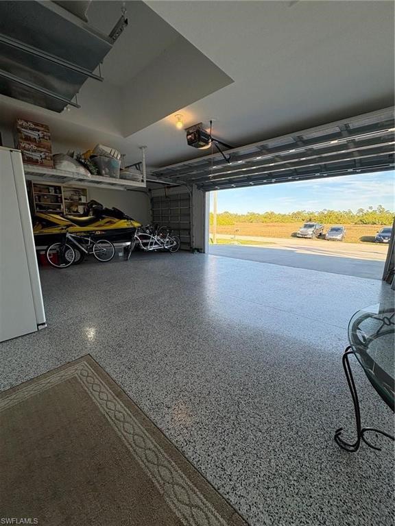 Garage with freestanding refrigerator