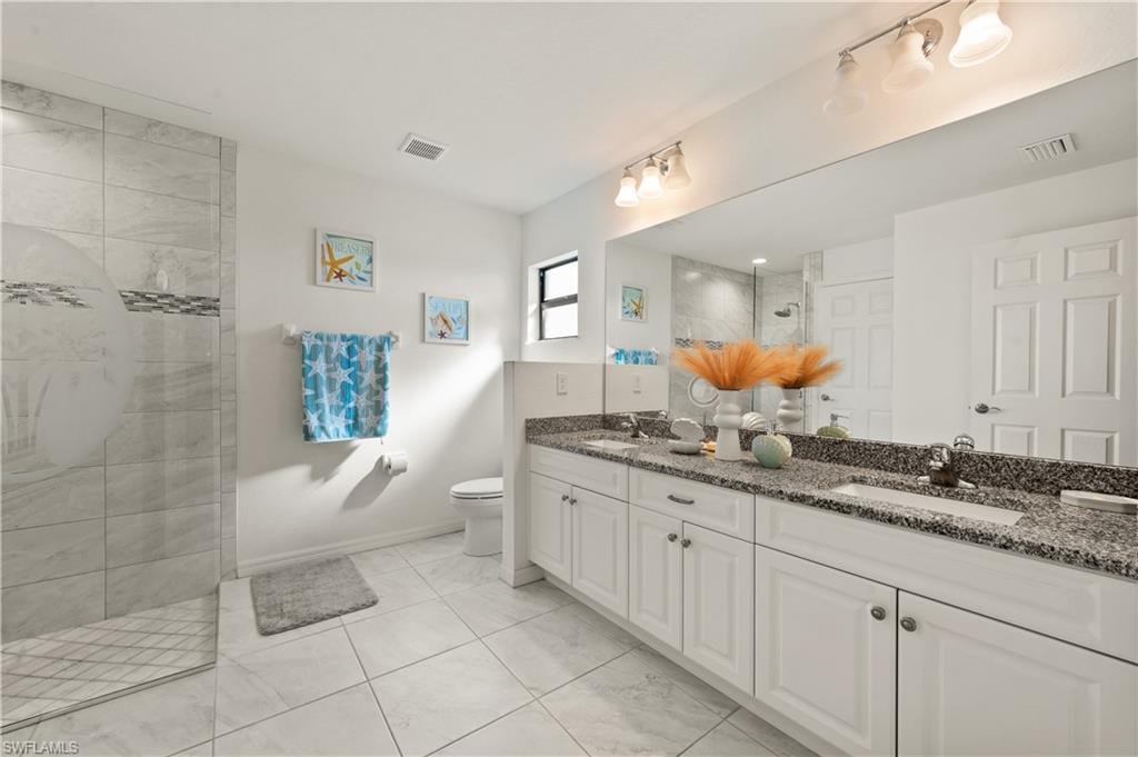 Bathroom with double vanity and a walk in shower