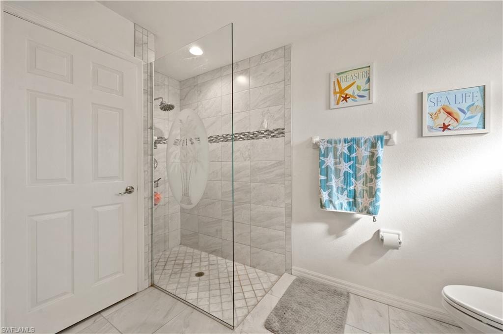 Bathroom featuring walk in shower and recessed lighting