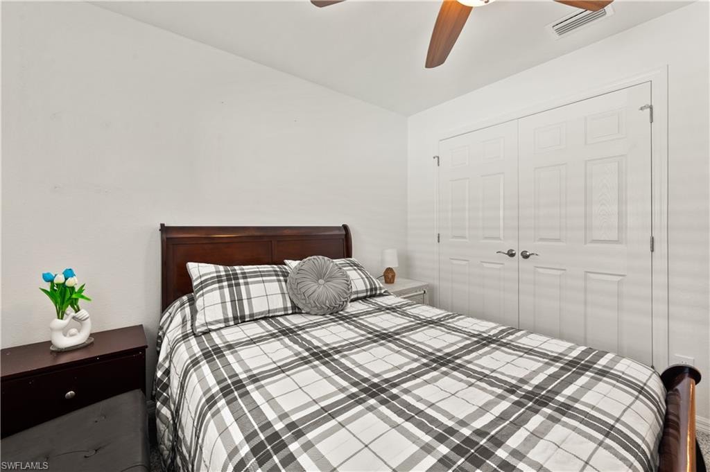 Bedroom featuring a closet and ceiling fan