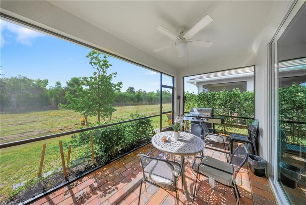 Sunroom featuring ceiling fan