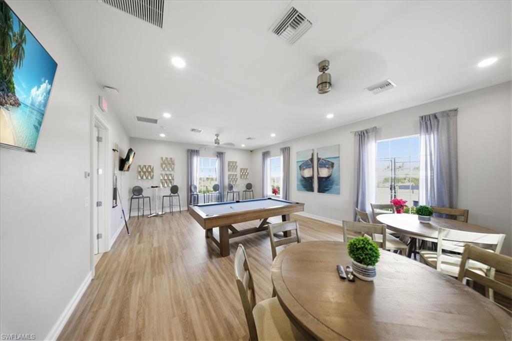 Rec room with billiards table and recessed lighting