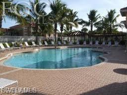 Community pool with a patio area