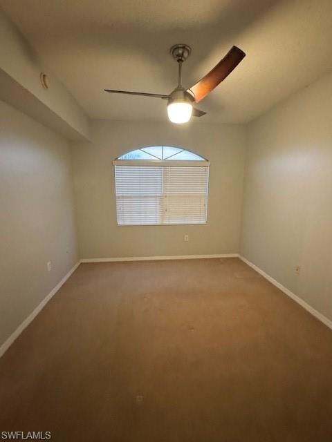 Spare room with carpet and a ceiling fan