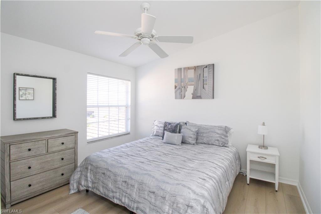 Bedroom featuring ceiling fan and light wood-type flooring