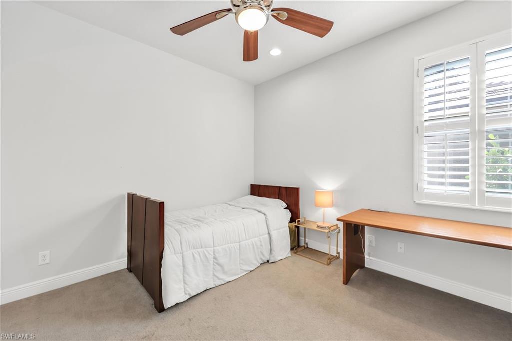 Bedroom with carpet flooring, a ceiling fan, and recessed lighting