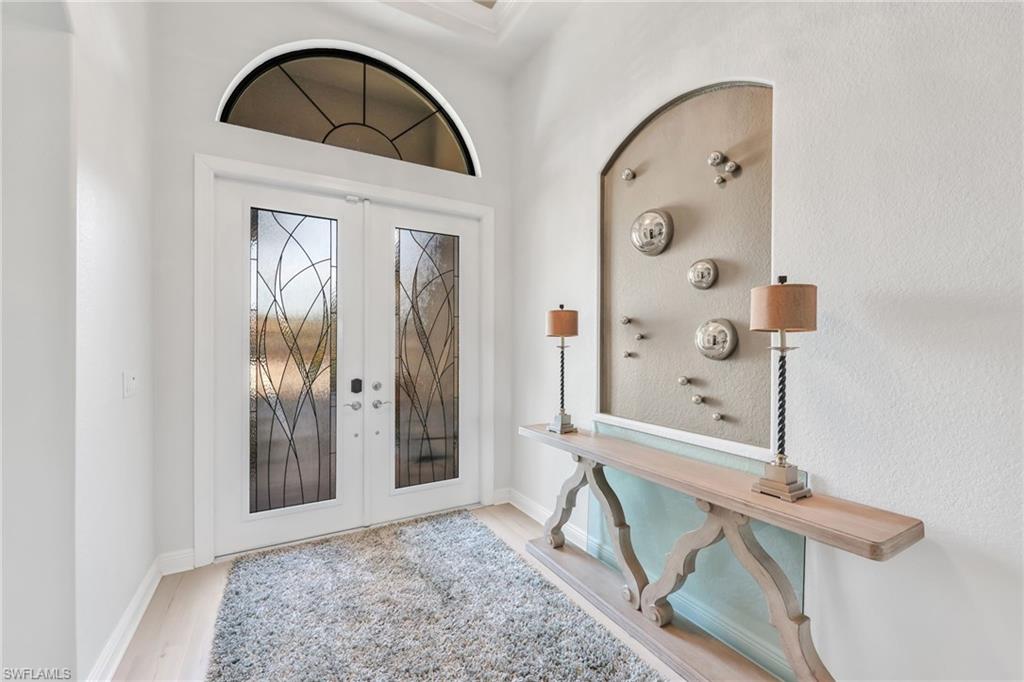 Foyer featuring french doors and light wood-type flooring
